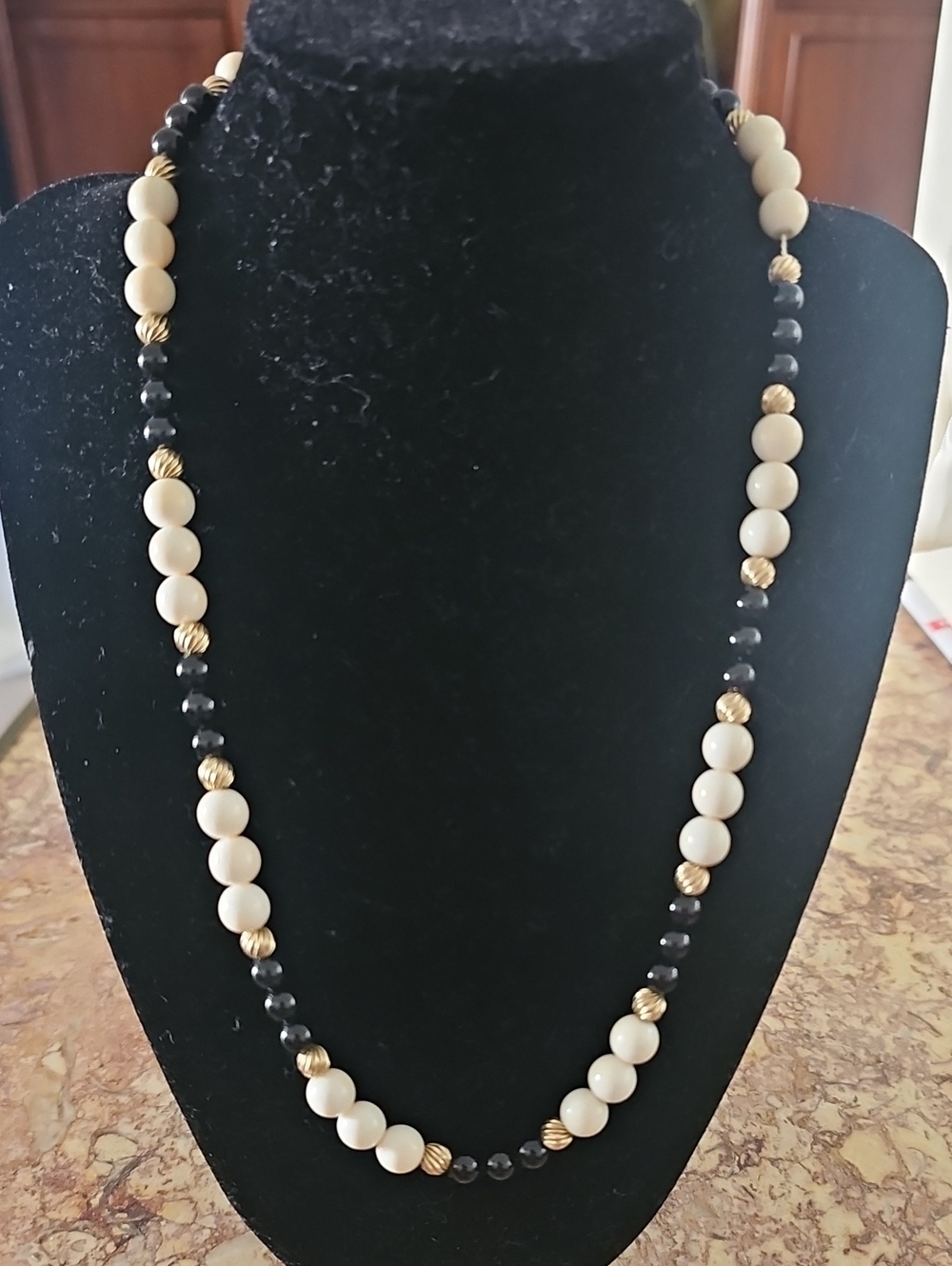 Elegant Cream and Black Beaded Necklace with Gold Accents